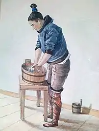 Grønlandsk kvinde vasker tøj