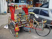 En indonesisk cykel-rickshaw kaldet en becâk, Foto: Jonathan McIntosh,