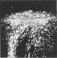 Lambdapunkt transition: mens væsken bliver nedkølet ned gennem 2.17 K, bliver kogningen pludseligt kraftig i et øjeblik.