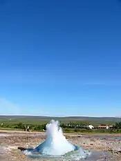 Circle of water, with a geyser filling the circle of water.
