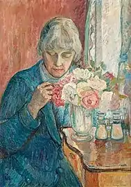 Hans kone Kris Torne (no) med en buket roser, 1915